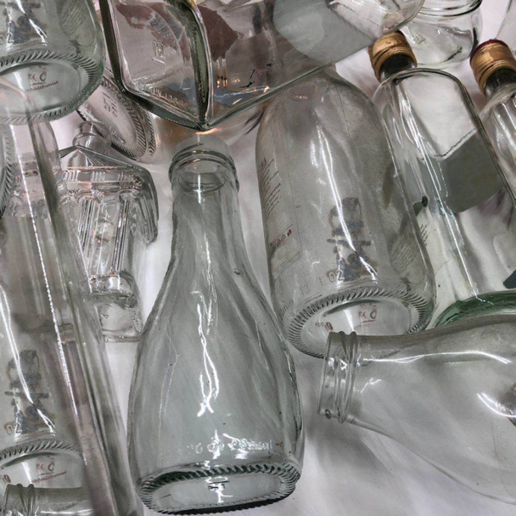 glass bottles to repurpose at home as vases, avoid throwing them out