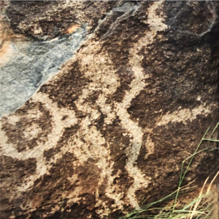 hunchback kokopelli god carving in stone in new mexico