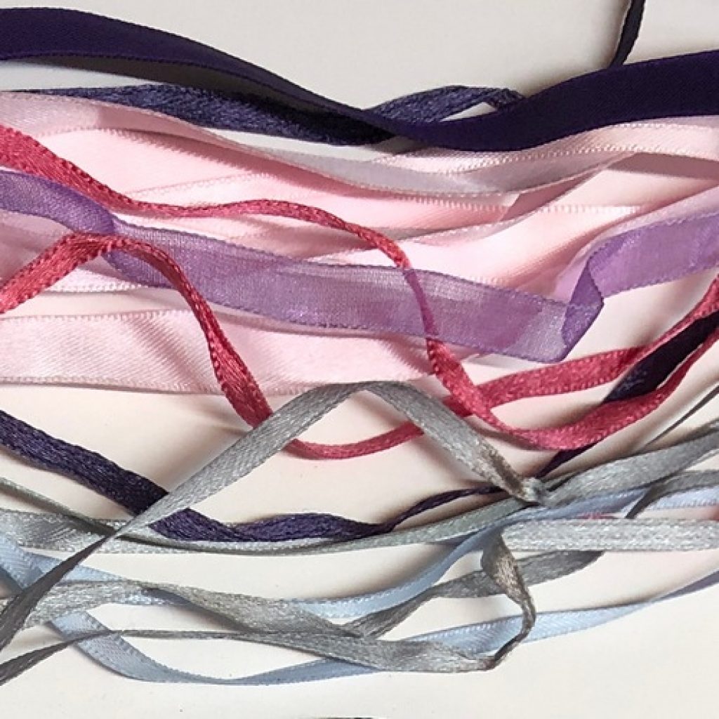 textile ribbons cut out from sweaters and tshirts closeup, repurposing at home DIY project ideas