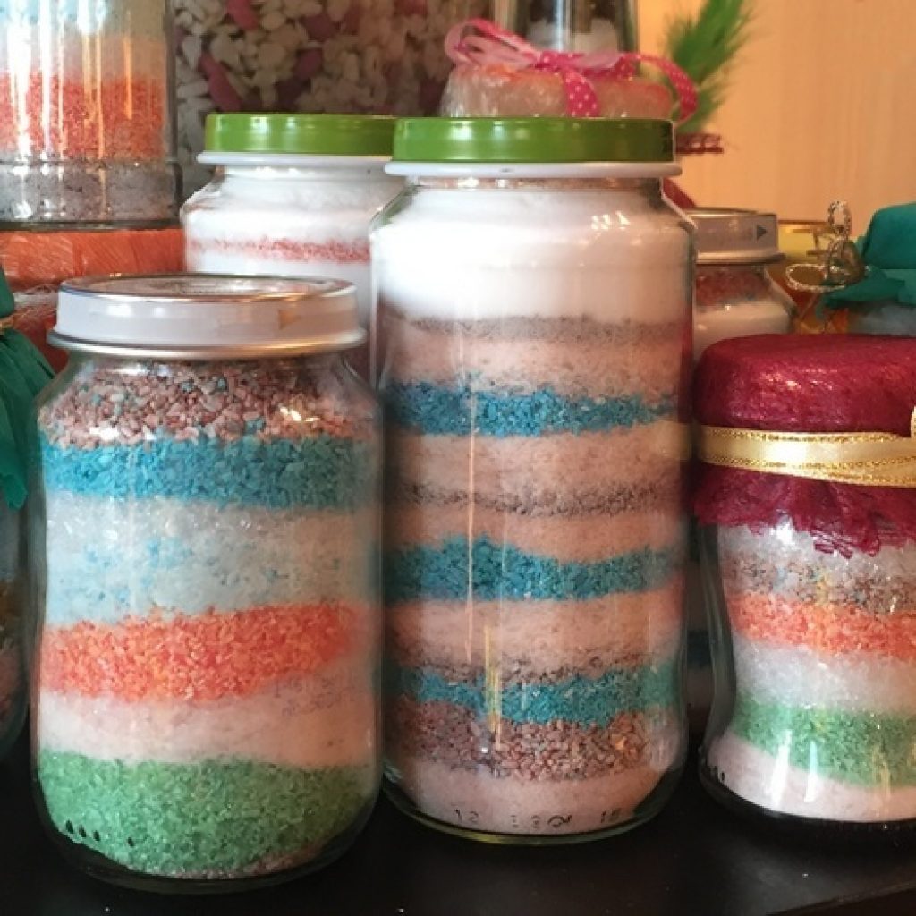 colored bath salts in glass containers diy repurposing ideas