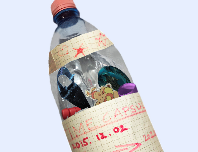 time capsule in repurposed plastic bottle